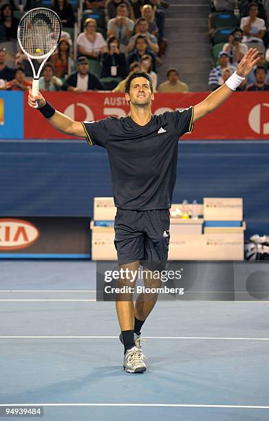 Novak Djokovic of Serbia reacts after winning his match against Marcos Baghdatis of Cyprus on day seven of the Australian Open Tennis Championship,...