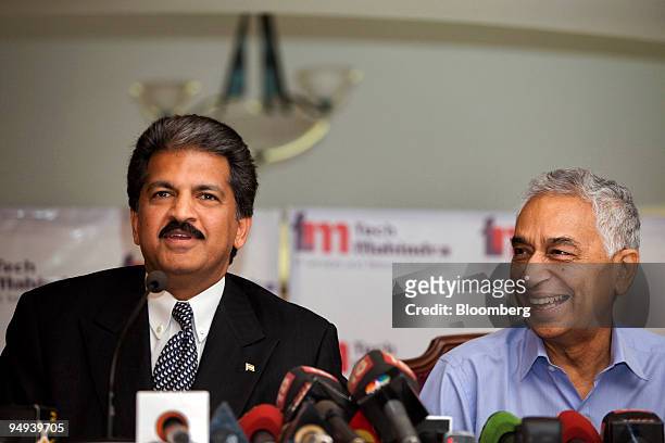 Anand Mahindra, chairman of Tech Mahindra Ltd., left, and Vineet Nayyar, chief executive officer of Tech Mahindra, speak during a news conference in...