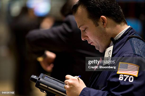 Robert Vella works on the floor of the New York Stock Exchange in New York, U.S., on Monday, April 13, 2009. U.S. Stocks fell, sending the Standard &...