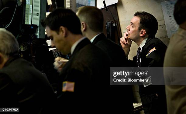 Traders work on the floor of the New York Stock Exchange in New York, U.S., on Monday, April 13, 2009. U.S. Stocks fell, sending the Standard &...