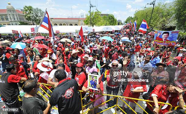 Supporters of Thaksin Shinawatra, Thailand's former prime minister, gather as a protest ended outside Government House in Bangkok, Thailand, on...