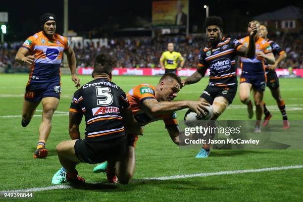 Shaun Kenny-Dowall of the Knights scores a try during the round seven NRL match between the Wests Tigers and the Newcastle Knights at Scully Park on...