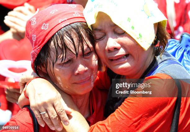 Supporters of Thaksin Shinawatra, Thailand's former prime minister, cry after their leaders decided to end a protest in front of Government House in...