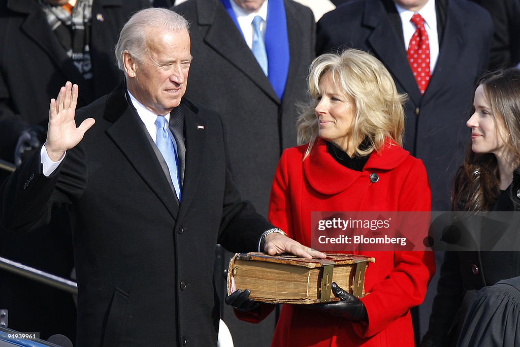 U.S. Vice President Joe Biden, left, is sworn in as his wife