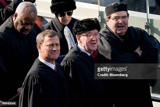 Supreme Court Justices, from left, Clarence Thomas, John Roberts, Ruth Bader Ginsburg, John Paul Stevens and Antonin Scalia attend the inauguration...