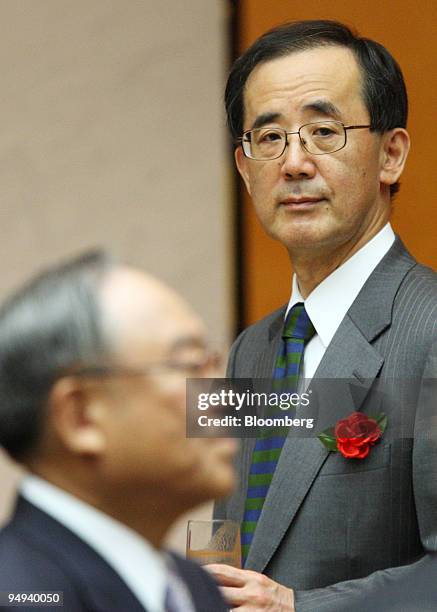 Masaaki Shirakawa, governor of the Bank of Japan, right, attends the opening reception for newly constructed Keidanren Kaikan, the Japan Business...