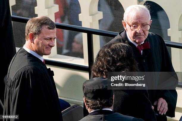 John Roberts, chief justice of the Supreme Court, left, and Justice John Paul Stevens attend the inauguration ceremony of U.S. President Barack Obama...