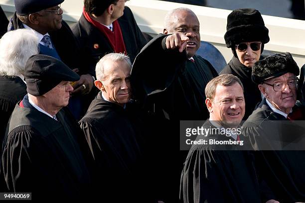 Supreme Court Justices, from left, Anthony M. Kennedy, David Souter, Clarence Thomas, John Roberts, Ruth Bader Ginsburg, and John Paul Stevens attend...