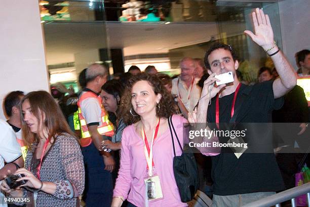 Guests and staff of the Metropark Hotel cheer as they are released from quarantine in Hong Kong, China, on Friday, May 8, 2009. 286 guests and staff...