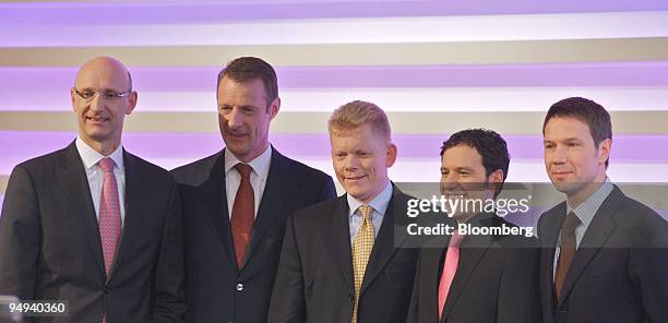 Rene Obermann, right, chief executive officer of Deutsche Telekom AG, presents the new management board of the company, from left to right: Timotheus...