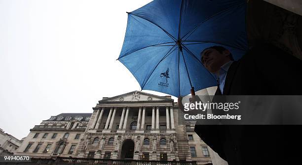 Aaron Such passes the Bank of England in London, U.K., on Thursday, Feb. 5, 2009. The Bank of England cut the benchmark interest rate to the lowest...