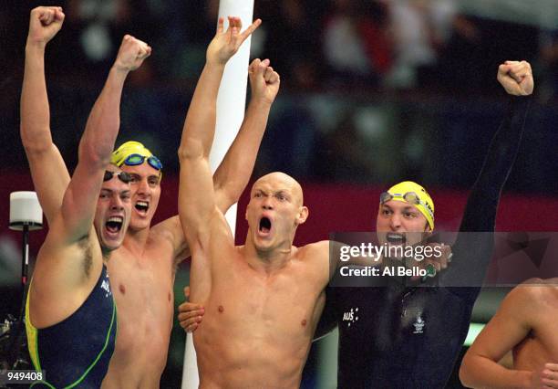 Ashley Callus, Chris Fydler, Michael Klim and Ian Thorpe of Australia celebrate after winning Gold in the Mens 4x100m Freestyle Relay at the Sydney...