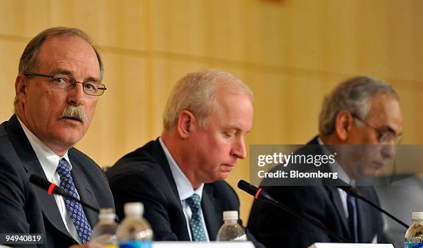 Stephen Joynt, president and chief executive officer of Fitch Inc., left, Raymond McDaniel, chief executive officer of Moody's Investors Service,...