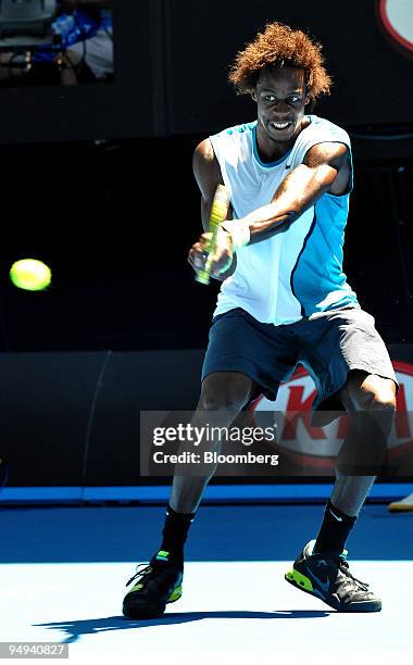 Gael Monfils of France returns the ball to Gilles Simon of France on day eight of the Australian Open Tennis Championship, in Melbourne, Australia,...