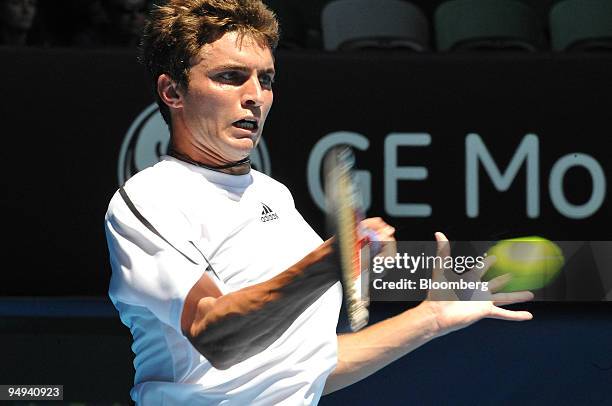 Gilles Simon of France returns the ball to Gael Monfils of France on day eight of the Australian Open Tennis Championship, in Melbourne, Australia,...