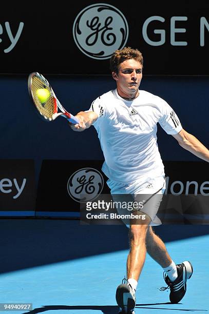 Gilles Simon of France returns the ball to Gael Monfils of France on day eight of the Australian Open Tennis Championship, in Melbourne, Australia,...