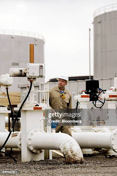 Scott Swiech monitors an automated manifold as it directs the flow of oil at the Enbridge Inc. Cushing Terminal in Cushing, Oklahoma, U.S., on...