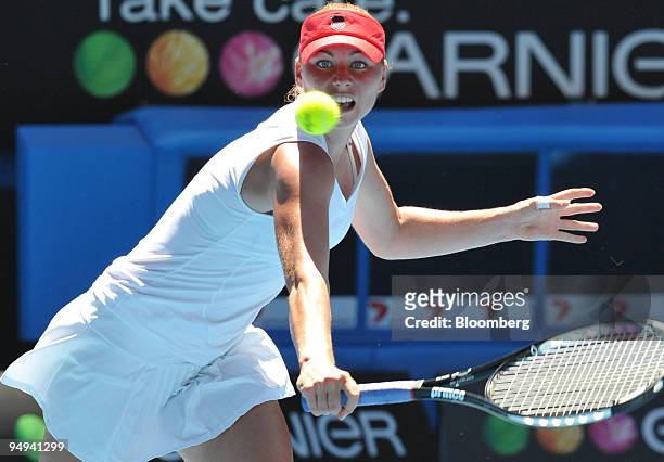 Vera Zvonareva of Russia returns the ball to Marion Bartoli of Italy on day nine of the Australian Open Tennis Championship, in Melbourne, Australia,...