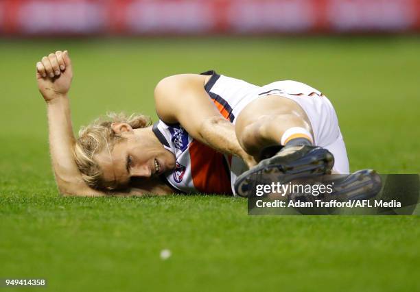 Nick Haynes of the Giants lays on the field sore after a collision during the 2018 AFL round five match between the St Kilda Saints and the GWS...