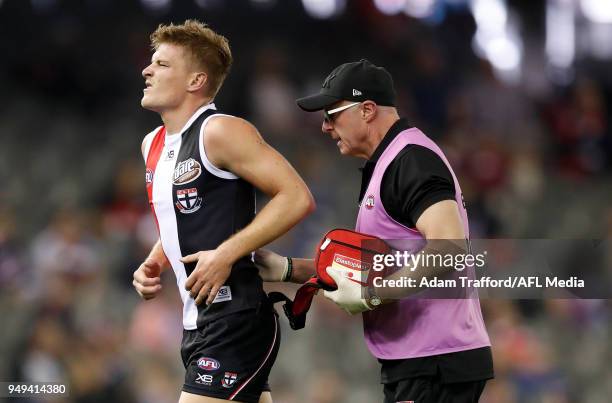 Jack Newnes of the Saints leaves the field after a clash with Dawson Simpson of the Giants during the 2018 AFL round five match between the St Kilda...