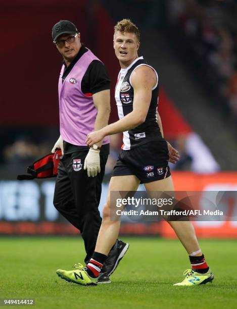 Jack Newnes of the Saints leaves the field after a clash with Dawson Simpson of the Giants during the 2018 AFL round five match between the St Kilda...