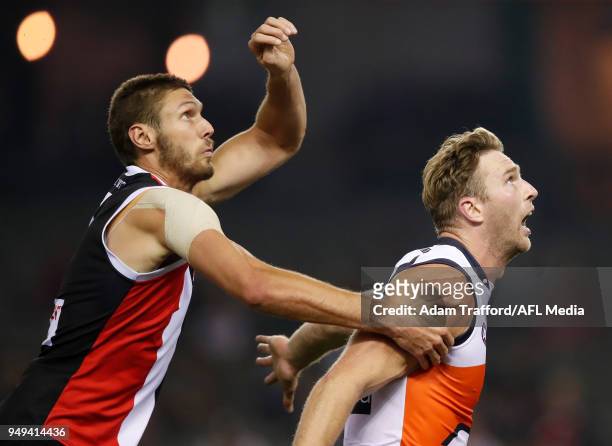 Tom Hickey of the Saints and Dawson Simpson of the Giants compete in a ruck contest during the 2018 AFL round five match between the St Kilda Saints...
