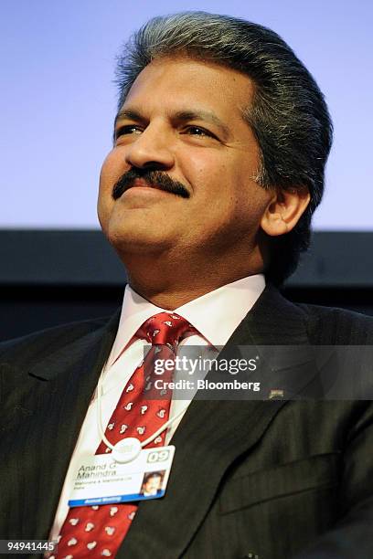 Anand G. Mahindra, vice chairman and managing director of Mahindra & Mahindra Ltd., smiles during a session on day four of the World Economic Forum...