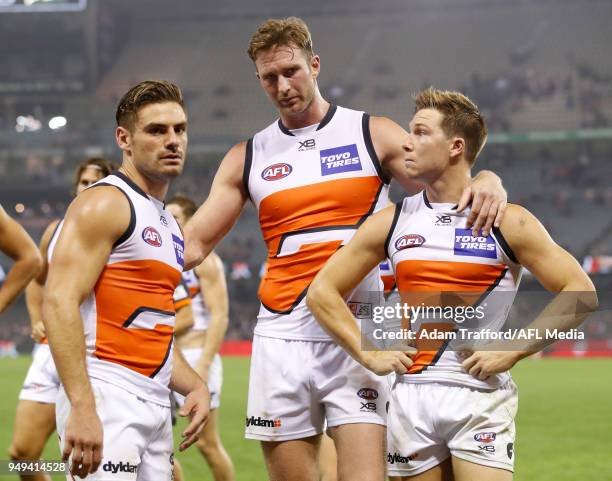 Stephen Coniglio, Dawson Simpson and Toby Greene of the Giants look dejected after a draw during the 2018 AFL round five match between the St Kilda...