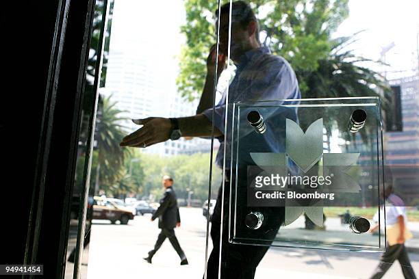 Man enters the building which houses the Mexican Stock Exchange, or Bolsa Mexicana de Valores , in Mexico City, Mexico, on Wednesday, May 20, 2009....