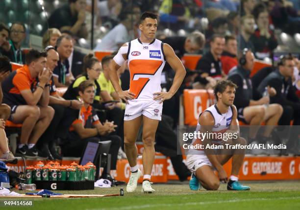 Dylan Shiel of the Giants is stuck on the interchange bench with the ball on the other side of the ground in the final few minutes of play during the...