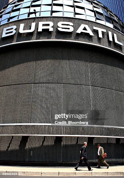 Pedestrians walk outside the building which houses the Mexican Stock Exchange, or Bolsa Mexicana de Valores , in Mexico City, Mexico, on Wednesday,...