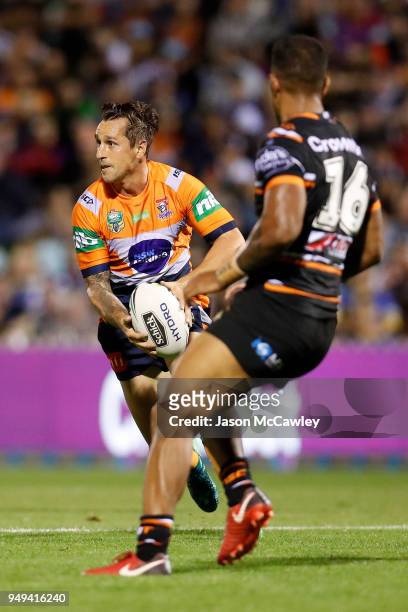 Mitchell Pearce of the Knights runs the ball during the round seven NRL match between the Wests Tigers and the Newcastle Knights at Scully Park on...