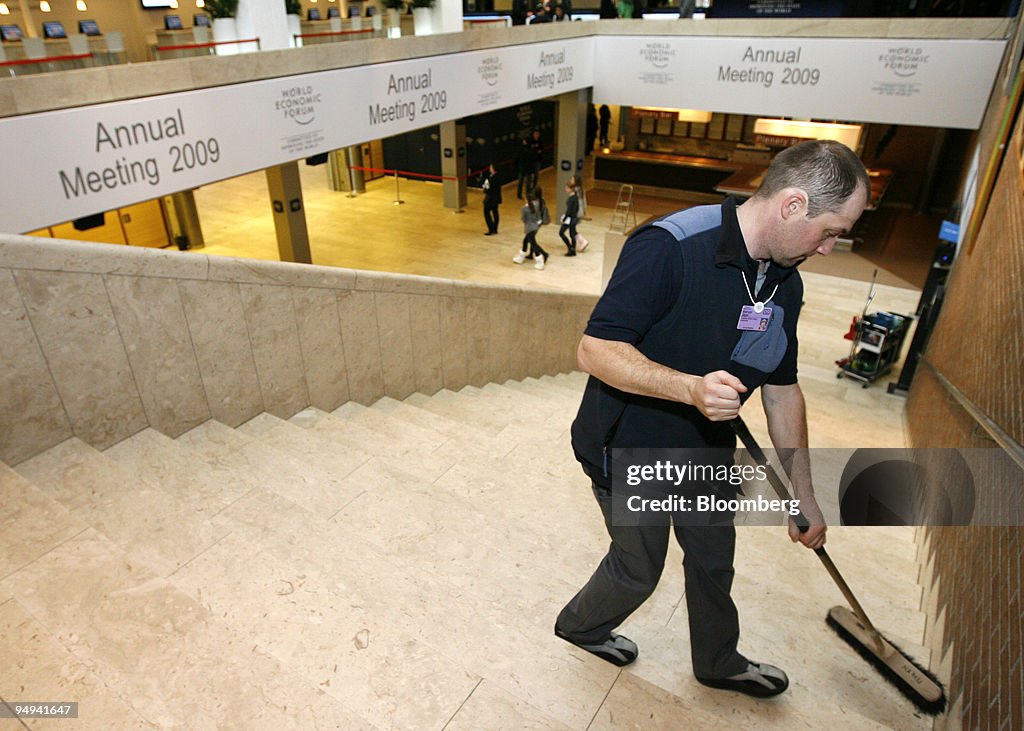 Employee Manuel Jaeger sweeps the main stairway in the Congr