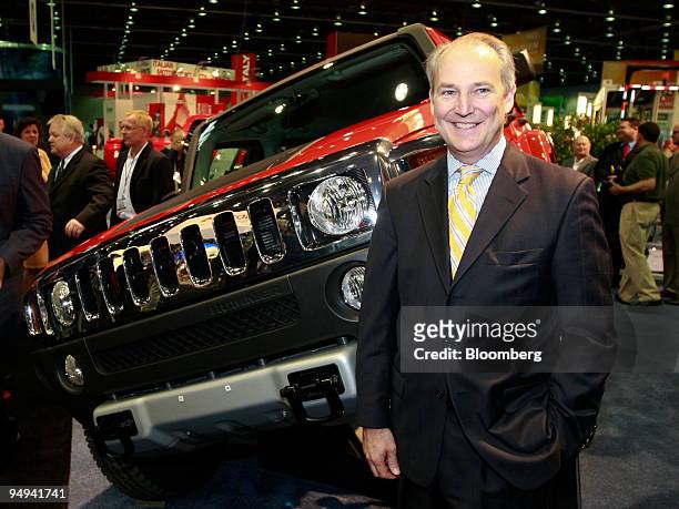 James "Jim" Taylor, chief executive officer of General Motor's Hummer unit, poses with a Hummer H3 during a news conference in Detroit, Michigan,...