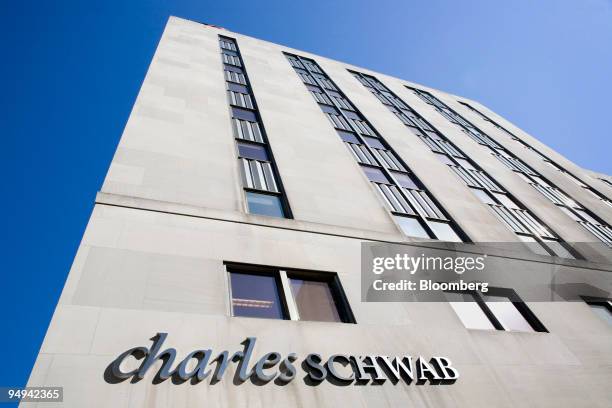 The company sign hangs outside a Charles Schwab branch in New York, U.S., on Tuesday, Feb. 24, 2009. Charles Schwab Corp. And other 401 account...