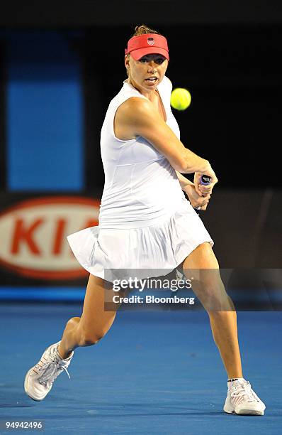 Vera Zvonareva of Russia returns the ball to Dinara Safina of Russia during their match on day 11 of the Australian Open Tennis Championship, in...