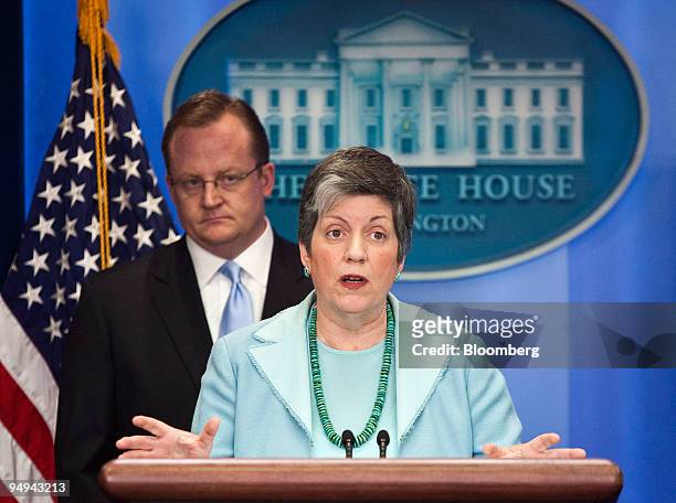 Janet Napolitano, secretary of the Department of Homeland Security, right, speaks as Richard Gibbs, White House press secretary, looks on during a...