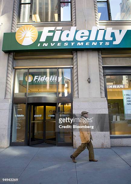 Pedestrian walks outside a Fidelity branch in New York, U.S., on Tuesday, Feb. 24, 2009. Fidelity Investments, Charles Schwab Corp. And other 401...