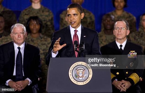 President Barack Obama speaks to an audience of Marines at Camp Lejeune, North Carolina, U.S., on Friday, Feb. 27, 2009. Listening at rear are...