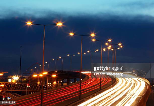 Vehicle traffic streams around London's North Circular road near Brent Cross, in London, U.K., on Wednesday, March 4, 2009. Two thousand researchers...