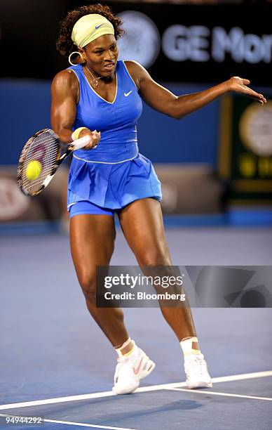 Serena Williams of the U.S. Returns the ball to Dinara Safina of Russia during the women's final match on day 13 of the Australian Open Tennis...