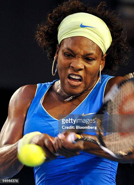 Serena Williams of the U.S. Returns the ball to Dinara Safina of Russia during the women's final match on day 13 of the Australian Open Tennis...