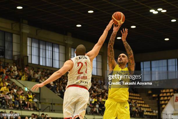 Robert Sacre of the Sunrockers Shibuya shoots under pressure from Gavin Edwards of the Chiba Jets during the B.League game between Sunrockers Shibuya...