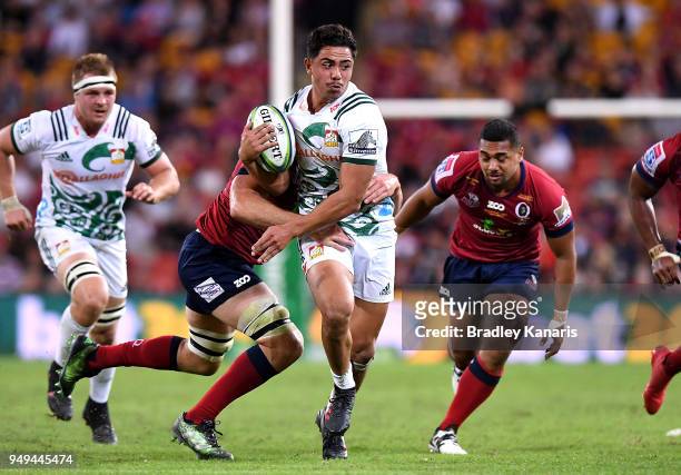 Anton Lienert-Brown of the Chiefs takes on the defence during the round 10 Super Rugby match between the Reds and the Chiefs at Suncorp Stadium on...