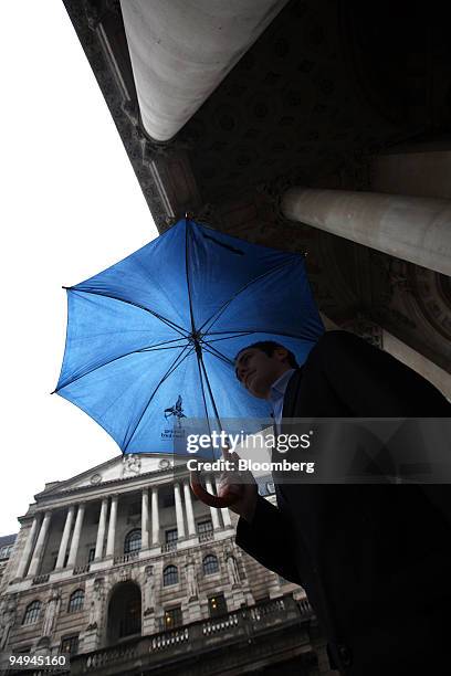 Aaron Such passes the Bank of England in London, U.K., on Thursday, Feb. 5, 2009. The Bank of England cut the benchmark interest rate to the lowest...