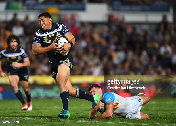 Jason Taumalolo of the Cowboys makes a break on his way to score a try during the round seven NRL match between the North Queensland Cowboys and the...