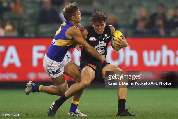 Brad Sheppard of the Eagles tackles Charlie Curnow of the Blues during the round five AFL match between the Carlton Blues and the West Coast Eagles...