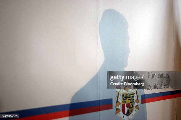 The shadow of Prince Alois of Liechtenstein is seen during a news conference in Vaduz, Liechtenstein, on Thursday, March 12, 2009. Liechtenstein...