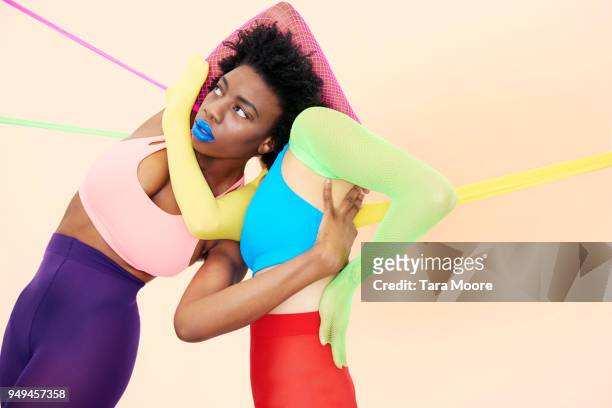 people entwined in colourful clothing - support concept stock pictures, royalty-free photos & images
