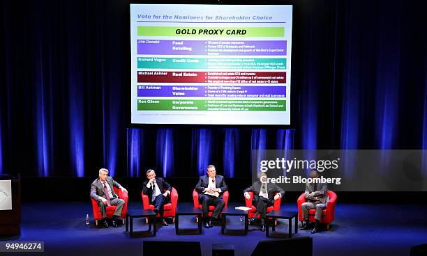 William Ackman, chief executive officer of Pershing Square Capital Management LP, left, listens to a question from an investor along with, from...